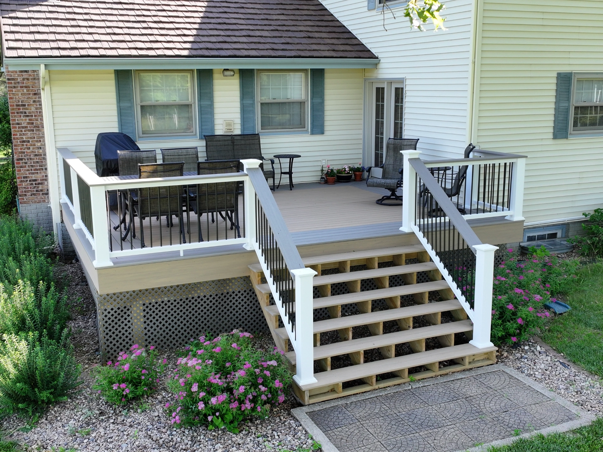 Custom deck with premium composite white railing and black aluminum